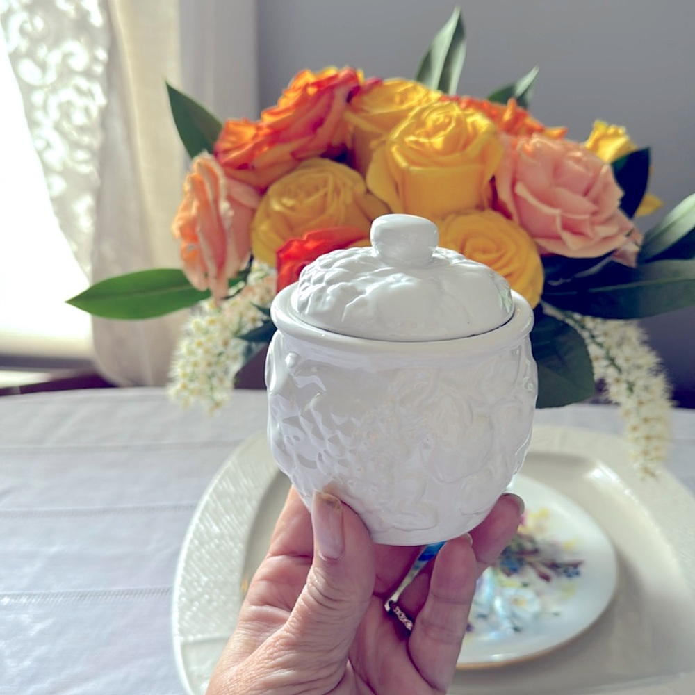 small canister, match stick holder, fruit, and flower decorated lid canister